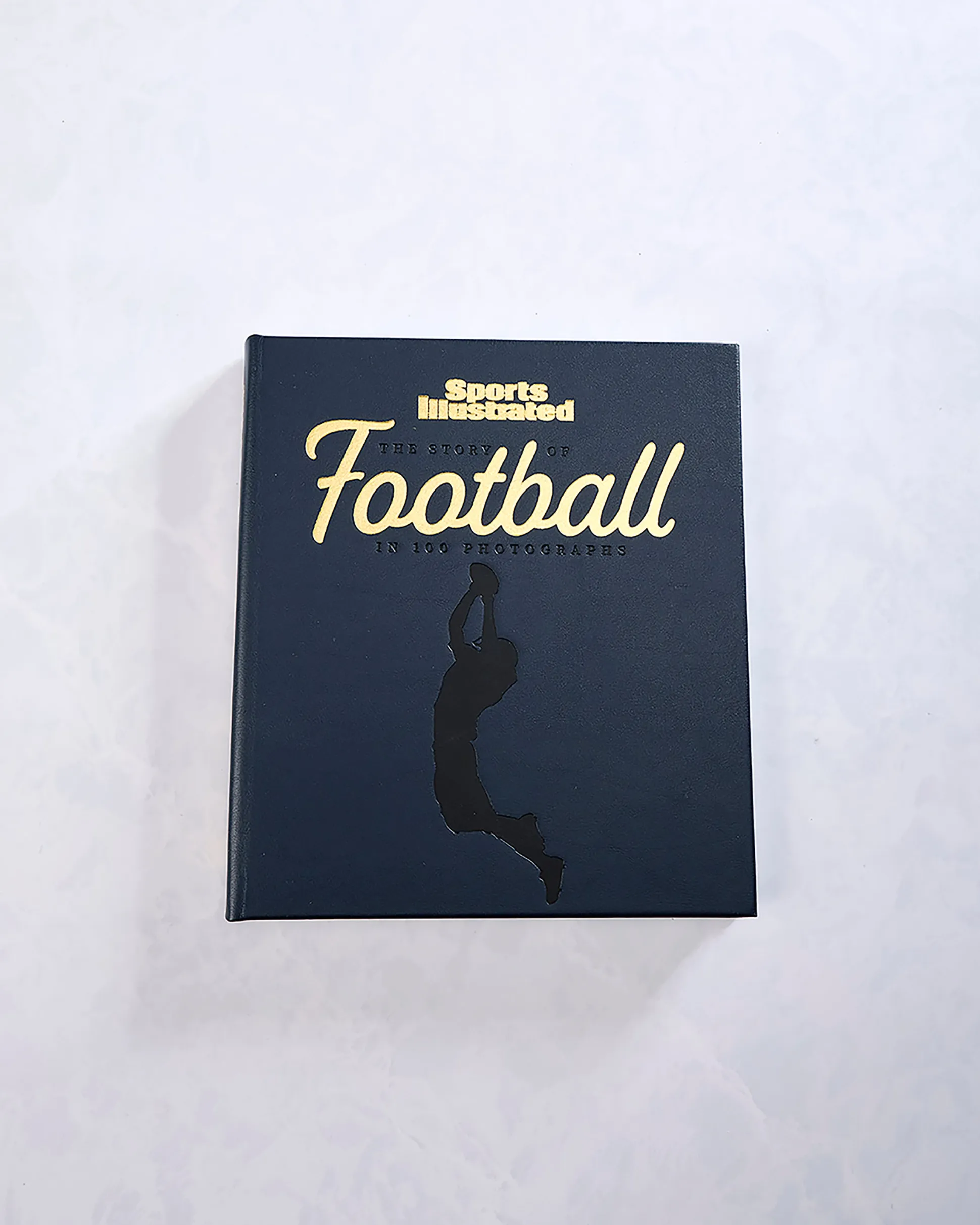 The Story of Football in 100 Photographs By Sports Illustrated in Navy Blue